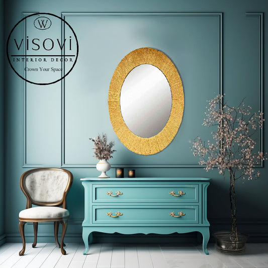 Decorative oval mirror in sculptural gold frame for interiors, hotels and commercial spaces