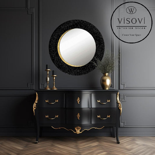 Round black wall mirror ONULI with shimmering finish and gold accent